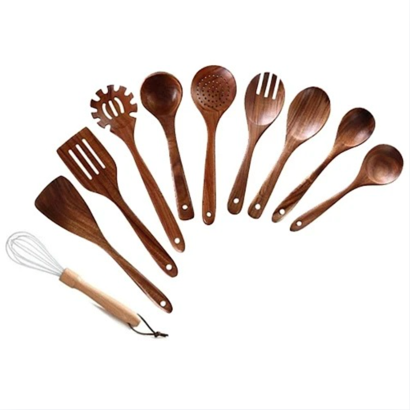 Set of wooden kitchen utensils including spoons, spatulas, and a whisk on a white background