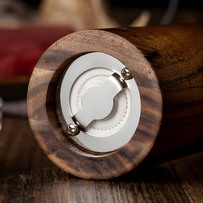 Close-up of the ceramic grinding system of the Salt & Pepper acacia wood grinder.