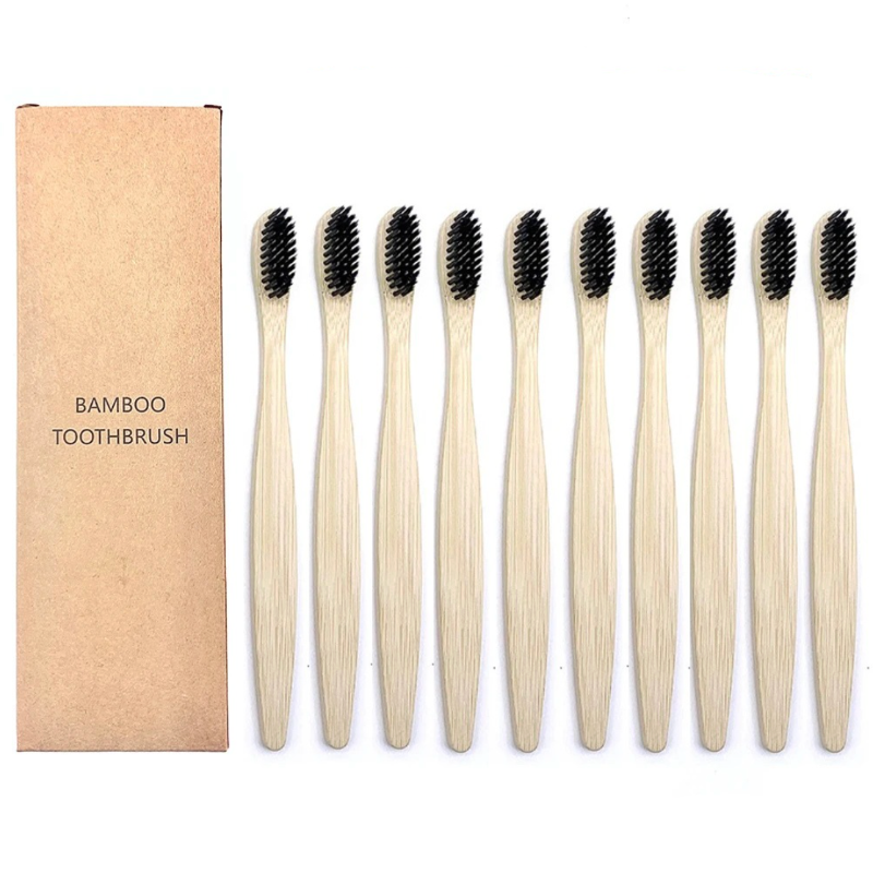 Set of bamboo toothbrushes with black bristles and a cardboard box labeled 'Bamboo Toothbrush' on a white background.