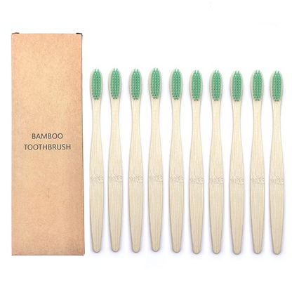 Set of bamboo toothbrushes with green bristles and a cardboard box labeled 'Bamboo Toothbrush' on a white background.