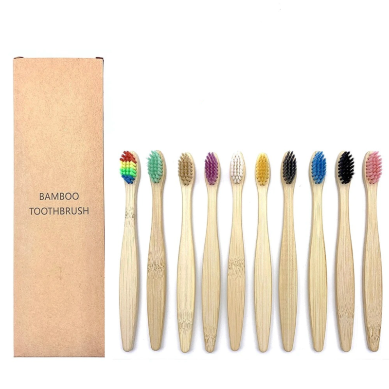 Set of kids bamboo toothbrushes with colored bristles and a cardboard box labeled 'Bamboo Toothbrush' on a white background.