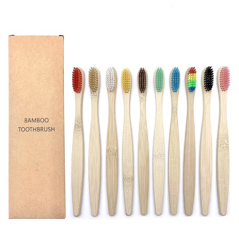 Set of bamboo toothbrushes with colored bristles and a cardboard box labeled 'Bamboo Toothbrush' on a white background.