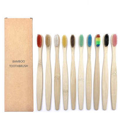 Set of bamboo toothbrushes with colored bristles and a cardboard box labeled 'Bamboo Toothbrush' on a white background.