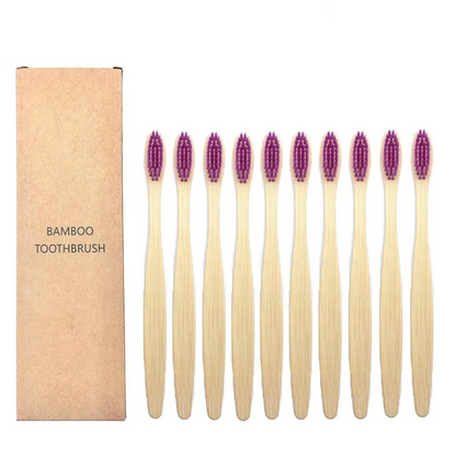 Set of bamboo toothbrushes with purple bristles and a cardboard box labeled 'Bamboo Toothbrush' on a white background.
