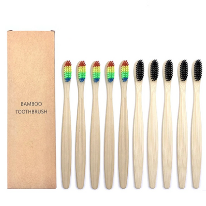 Set of bamboo toothbrushes with rainbow bristles and black bristles and a cardboard box labeled 'Bamboo Toothbrush' on a white background.