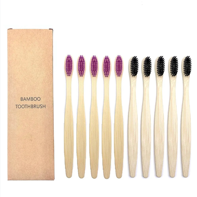 Set of bamboo toothbrushes with purple and black bristles, including a cardboard box labeled 'Bamboo Toothbrush'.