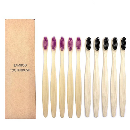 Set of bamboo toothbrushes with purple and black bristles, including a cardboard box labeled 'Bamboo Toothbrush'.