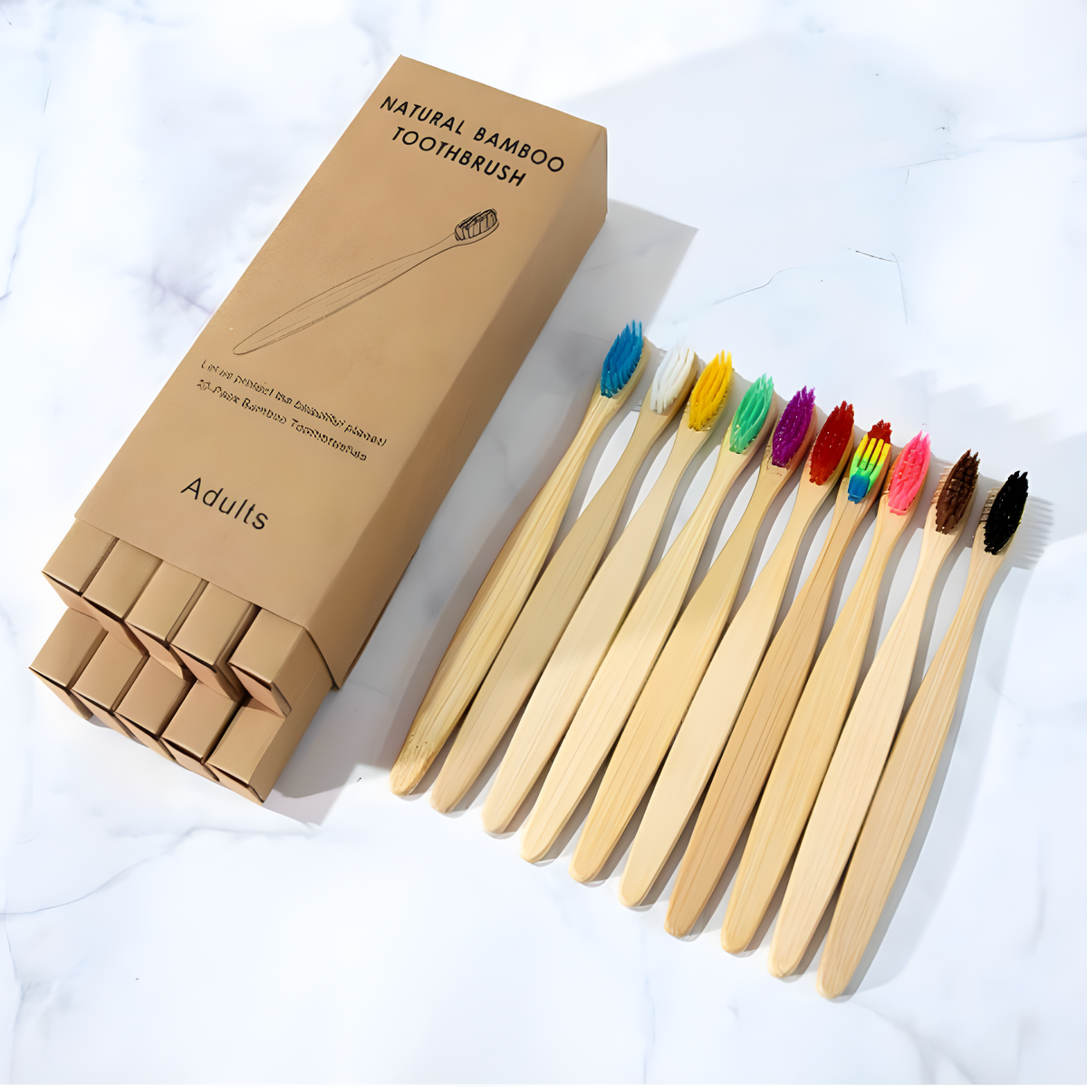 Bamboo toothbrush 10-pack with colourful bristles displayed next to recyclable kraft paper box, zero waste plastic-free family toothbrush set in mix colour.