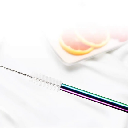 Rainbow straw with cleaning brush on a white background