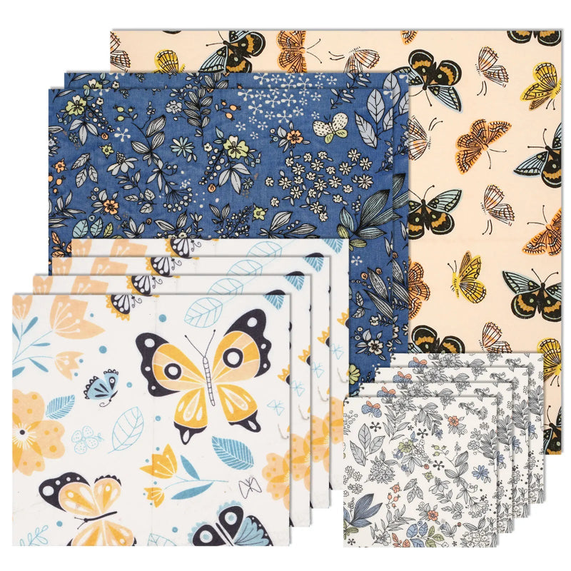 Full 11-piece reusable beeswax food wrap set flat lay displaying all wraps in four nature-inspired butterfly and floral prints, plastic-free BPA-free eco-friendly food storage.