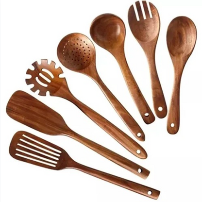 Set of wooden kitchen utensils including spoons and spatulas on a white background
