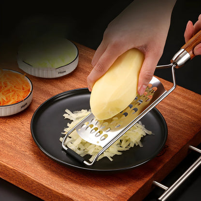 Hand grating potato onto a plate with a rosewood handle grater