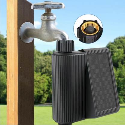 Solar water pump attached to a wooden post with a clear blue sky and greenery in the background.