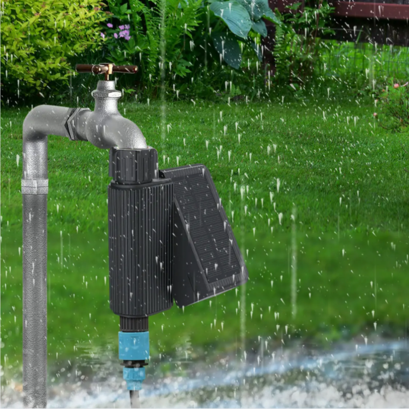 Solar water pump with hose connection on a grassy background