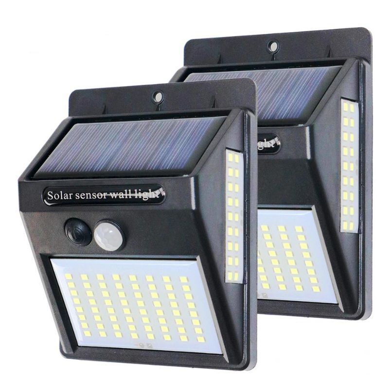 Two solar sensor wall lights on a white background