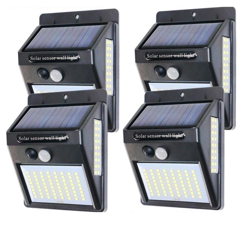 Four solar sensor wall lights on a white background